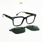 Black eyeglasses with a clip-on black sunglasses by HSF Eyewear on a white background