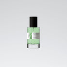 A bottle of 'Visco Garden - Boura' perfume with a clear green liquid visible inside, a black cap, and a white label.