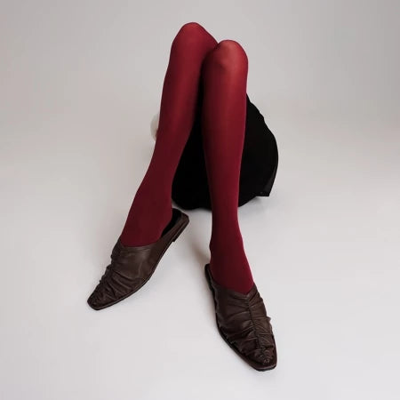 Red tights and brown Vonee Mules flat shoes by Cekhas on a white background