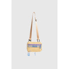 Small yellow crossbody bag with a strap from Muhajir Project on a light gray background