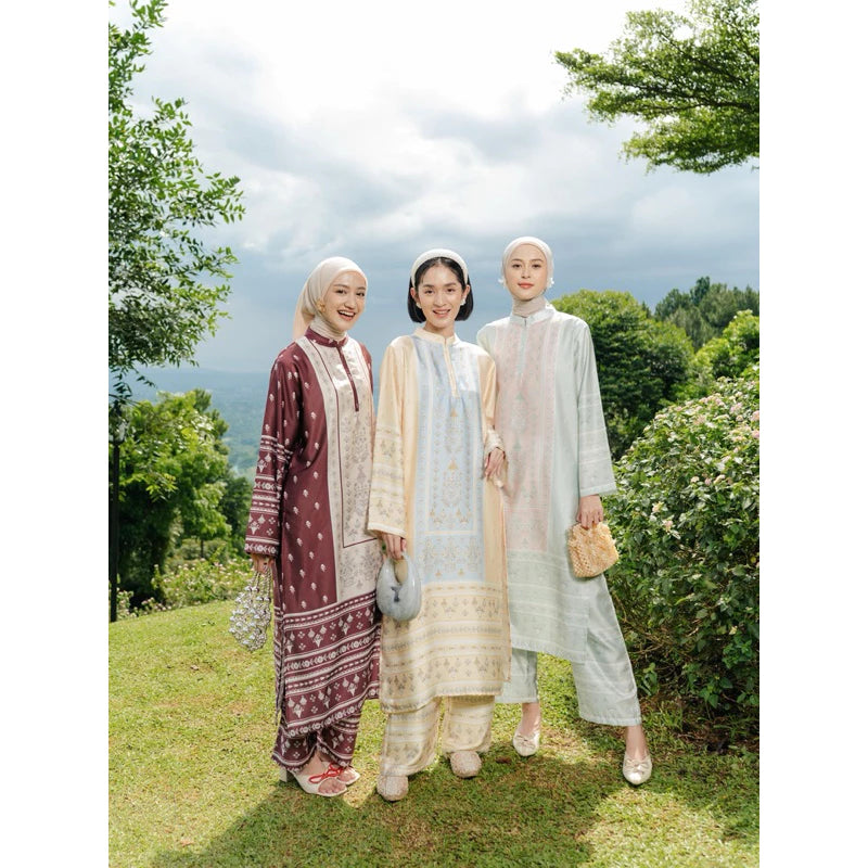 Three women in Zainara Set from Haidee Orlin standing outdoors with trees and grass in the background