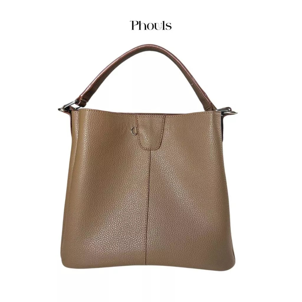 A brown Phouls handbag with a structured design, featuring top handles and a detachable long strap, displayed against a plain background.